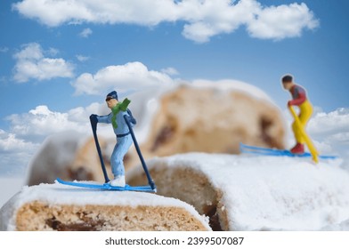 Skiers on a Christmas cake, miniature figures scene with the theme of sports during the Christmas holidays
​ - Powered by Shutterstock