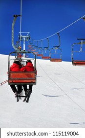 Skiers On A Ski Lift
