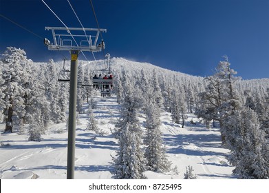 Skiers Are Riding Lift On A Very Cold Day At One Of The Lake Tahoe Ski Resorts (Sierra Nevada, USA).