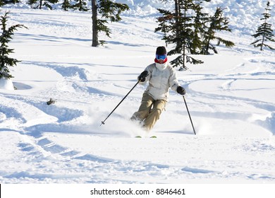 A Skiier Enjoying Fresh Snow In Whistler, BC.