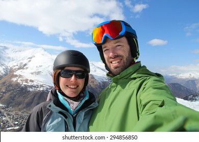 Skiing Couple Selfie - Winter Ski Vacation In French Alps.