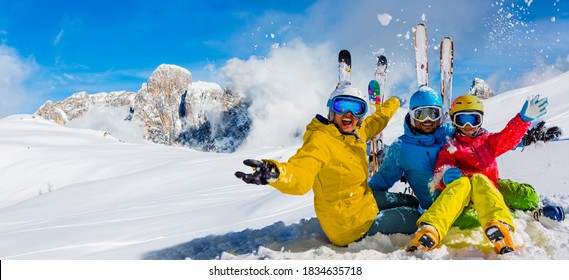 Skiing Family Enjoying Winter Vacation On Snow In Sunny Cold Day In Mountains And Fun. San Martino Di Castrozza, Italy.