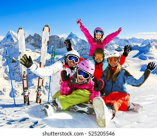Skiing family enjoying winter vacation on snow in sunny cold day in mountains and fun. Switzerland, Alps. Composite photo. - Shutterstock ID 525205546