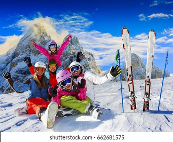 Skiing Family Enjoying Winter Vacation On Snow In Sunny Cold Day In Mountains And Fun. San Martino Di Castrozza, Italy. 