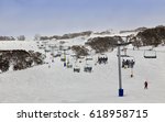 Skiing resort of Australia - Snowy mountains. Perisher valley cable-way transports skiers to mountain tops between snow fields and snow-gum trees.