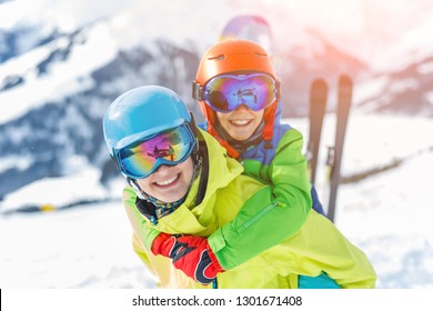 Skiing, Winter, Snow, Sun And Fun - Portrait Of Kids, Boy And Girl Having Fun In The Alps. Child Skiing In The Mountains. Vacation And Outdoor Snow Fun.