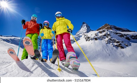 Skiing, Winter, Snow, Sun And Fun - Family Enjoying Winter Vacations In Zermatt, Switzerland.