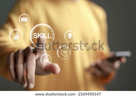 Skill concept. work performance is influenced by skills, abilities, and competence. Person touching SKILL word and icons on virtual screen.