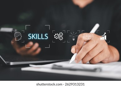 Up skill and personal development concept. Human resource development, leadership thinking upskill competency, creativity and problem solving. Businessman touching Skills icon on virtual screen.