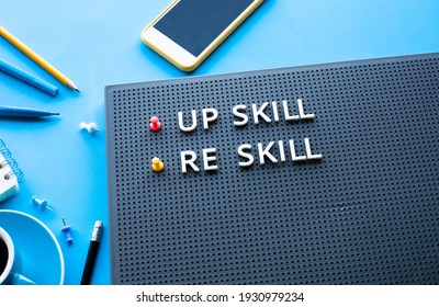 Up Skill And Re Skill Text On Desk Table. Performance Or Development Concepts Ideas