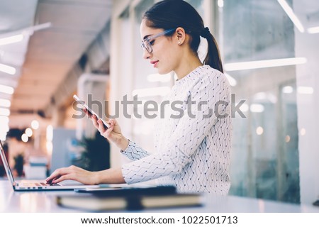 Skilled administrative manager organizing work of clinic sending feedbacks with schedule to clients using mobile phone,busnesswoman confirming login in banking account on netbook typing received code