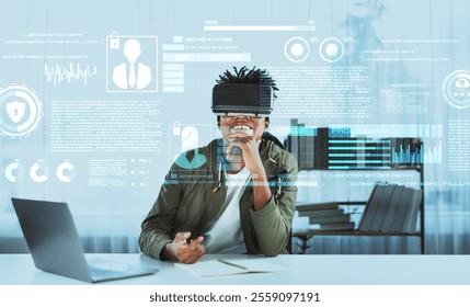 Skilled african man looking at personal data while wearing VR glasses. Person with casual shirt checking and analyzing security protection and accessing firewall protection. Technology. Ingenuity. - Powered by Shutterstock