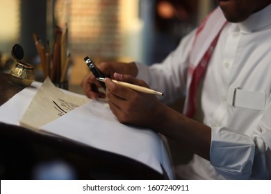 Skilled Arab Man doing Arabic Calligraphy