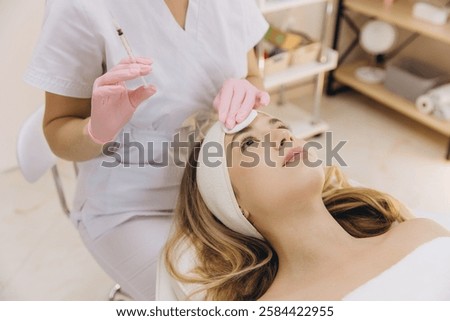 Similar – Image, Stock Photo Aesthetic Procedure Applying Botox, Hyaluronic Acid, and Tensor Threads