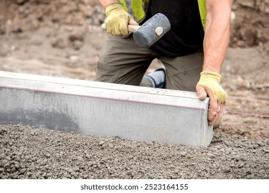 Skilled Craftsman Precisely Laying Concrete Blocks on Sunny Construction Site - Powered by Shutterstock