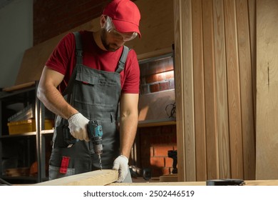 A skilled craftsman utilizes a drill to construct wooden projects in a well-organized workshop. The warm light sets the perfect atmosphere for detailed work, showcasing his focus and expertise - Powered by Shutterstock