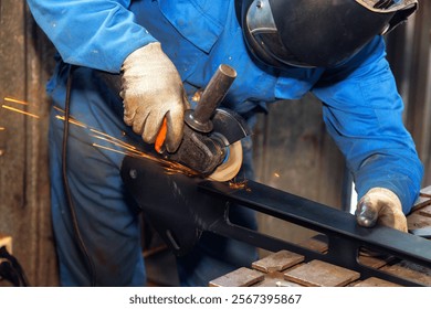 Skilled craftsperson grinds steel using tool in workshop, creating sparks, ensuring smooth finish. - Powered by Shutterstock