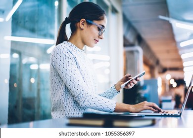 Skilled Female Receptionist Checking Notification Of Mails On Cellphone Working With Laptop Computer At Desk,professional Administrative Manager Of Office Using App For Organizing Data On Technologies
