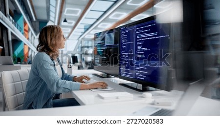 Skilled Female Software Developer Leading Coding Team In Modern Office.