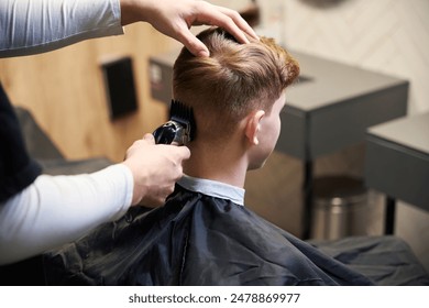 Skilled hairstylist working in contemporary hairdressing salon - Powered by Shutterstock