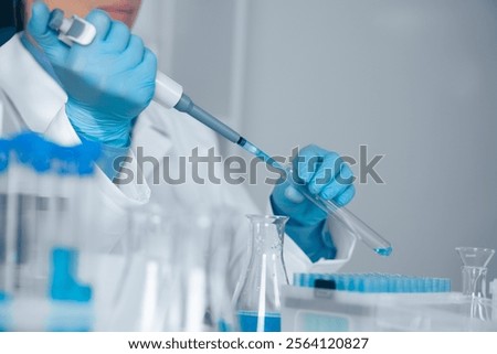 Similar – Image, Stock Photo Laboratory worker pipetting with pipette