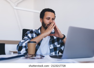 Skilled Male Employer Reading Financial Publication Concentrated On Received Business Information, Serious Executive Manager Browsing Website On Laptop Technology Connecting To 4g Wireless In Office