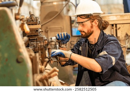 A skilled mechanical engineer is focused on repairing machinery in an industrial workshop, utilizing tools with precision and safety gear. The environment is busy and well-equipped.