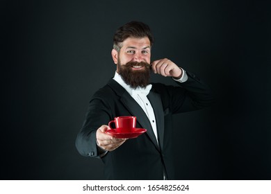 Skilled Professional With Passion For Coffee. Coffee Barista Black Background. Happy Barista Serve Cup Of Espresso. Tea Master Or Sommelier. Catering And Barista Service. Barista School.