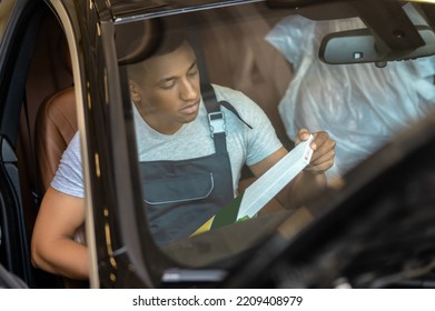 Skilled Service Station Worker Fixing The Client Car