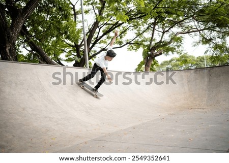 Similar – Junge Person mit Skateboard im Skatepark