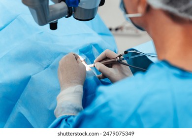 Skilled surgeon and his medical team performs precise eye surgery on an elderly patient, restoring vision with latest medical technology and cutting-edge techniques. Modern eye surgery concept.