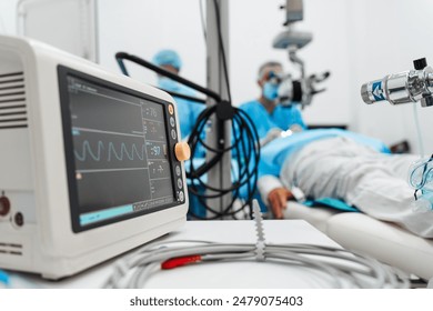 Skilled surgeon and his medical team performs precise eye surgery on an elderly patient, restoring vision with latest medical technology and cutting-edge techniques. Modern eye surgery concept. - Powered by Shutterstock