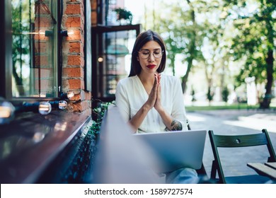 Skilled Woman In Classic Glasses Waiting For Email Confirmation About Online Web Order Via Laptop Computer, Attractive Woman Checking Blog Statistic During Leisure Time In Coworking Street Terrace