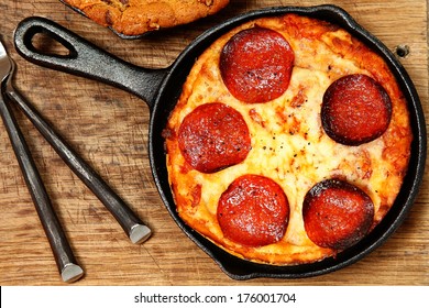 Skillet Peperonni Pizza On Table