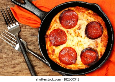 Skillet Peperonni Pizza On Table