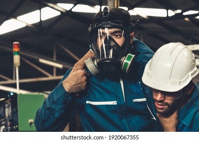 Skillful factory worker rescue his teammate out of poisonous gas leakage . Industry and engineering people accident and safety concept .