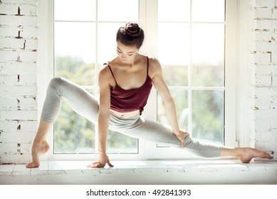 Skillful Modern Dancer Sitting In A Position