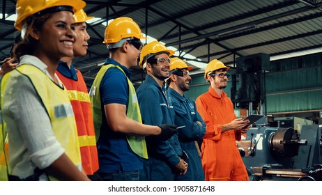 Skillful worker attending brief meeting in the factory . Industrial people and manufacturing labor concept . - Shutterstock ID 1905871648