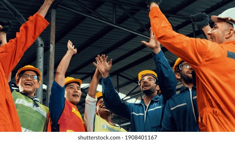 Skillful Worker Celebrate Success In The Factory . Industrial People And Manufacturing Labor Concept .