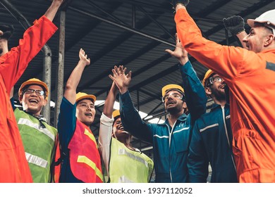 Skillful worker celebrate success in the factory . Industrial people and manufacturing labor concept . - Powered by Shutterstock