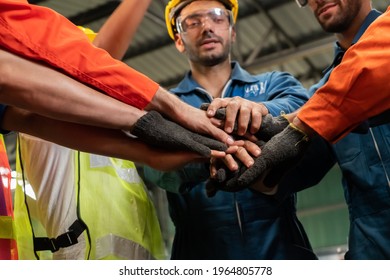 Skillful worker stand together showing teamwork in the factory . Industrial people and manufacturing labor concept . - Shutterstock ID 1964805778