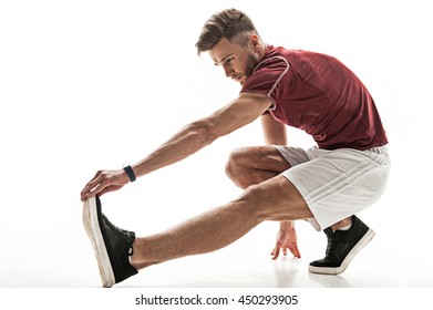 Skillful young sportsman doing exercise