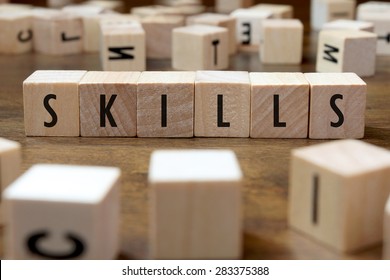 skills word written on wood block