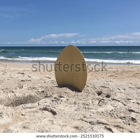 Skim board in the sand