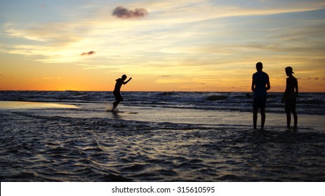 Skimboard At Sunset.