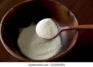 Skimmed Milk Powder In A Wooden Bowl