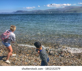 Skimming Stones On The Beach