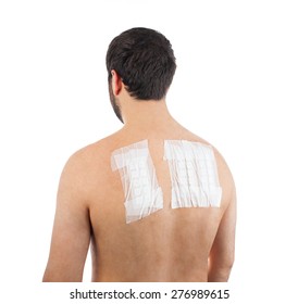 Skin Allergy Patch Test on Back of Male Patient On White Background