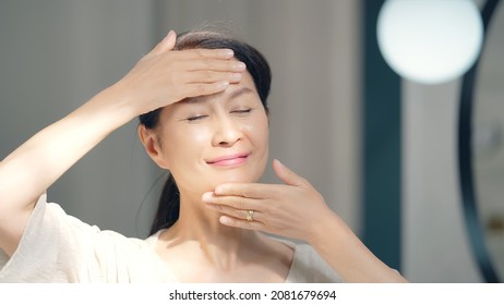 Skin Care Concept Of Asian Senior Woman. Anti Aging. Cosmetics.