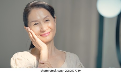 Skin Care Concept Of Asian Senior Woman. Anti Aging. Cosmetics.